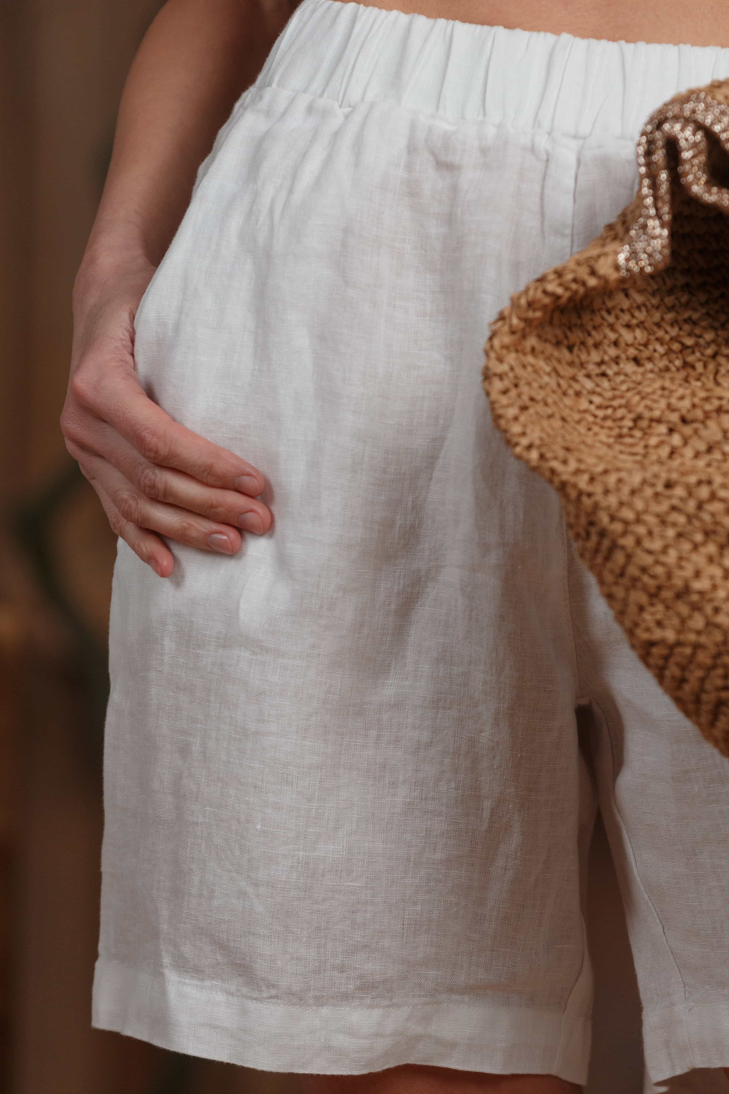 Highlighting the fine linen texture and neat stitching, these shorts bring a minimalist design with practical pockets, ideal for summer days in Dubai and across the GCC.