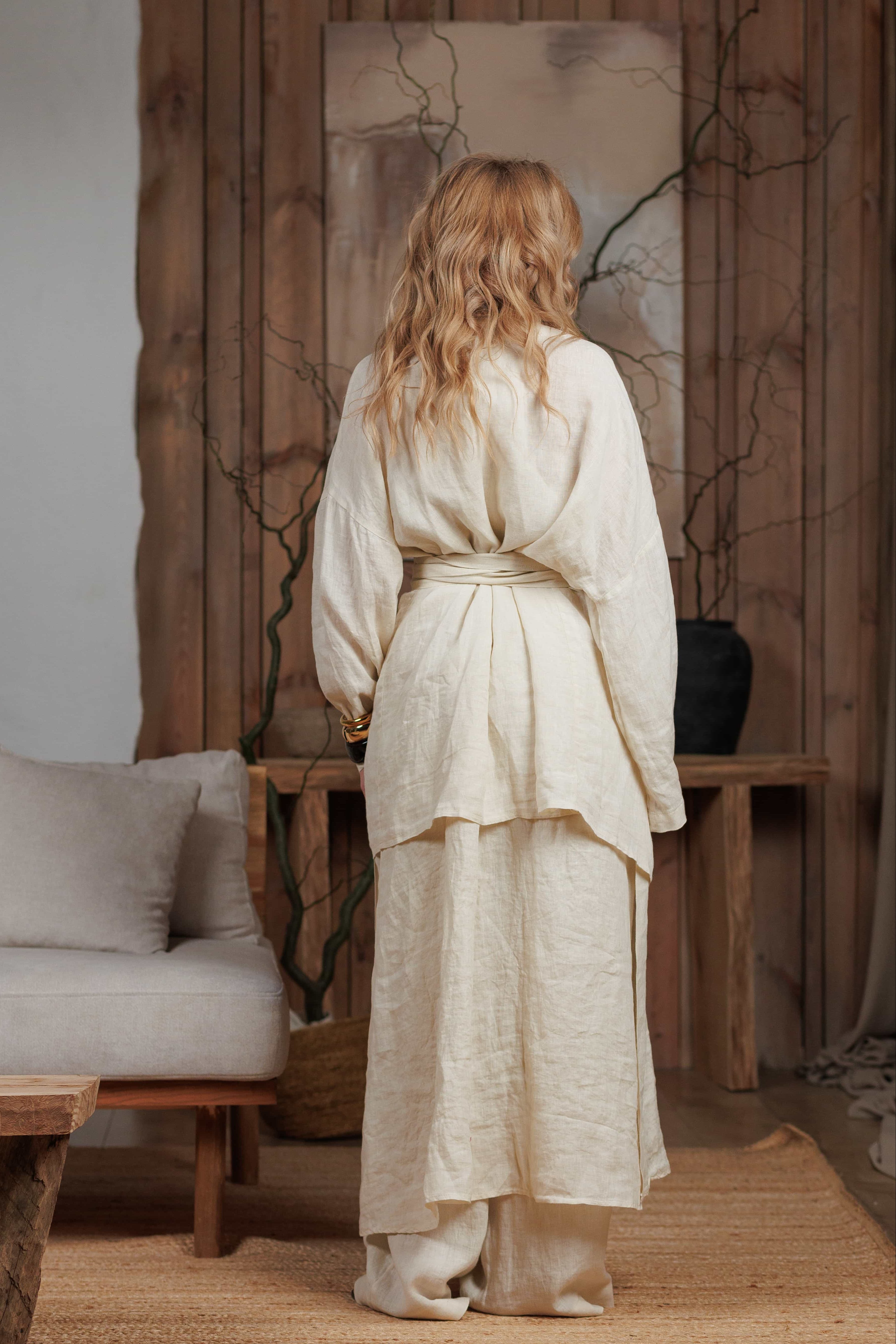 Back view of the beige linen kimono, showcasing its lightweight and airy design. Perfect for beach cover-ups, city strolls, and summer gatherings in Dubai, Abu Dhabi, and other GCC countries. The wrap-around design adds elegance and versatility.
